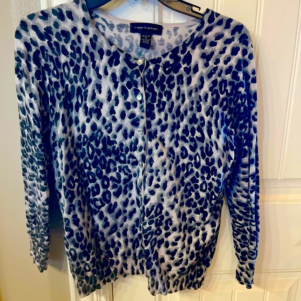 Cardigan, black and gray animal print, shiny buttons.